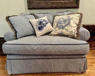 Comfy blue gingham loveseat with two pillows