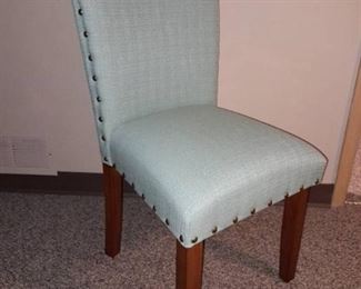 Nail head trim and upholstered armless chair