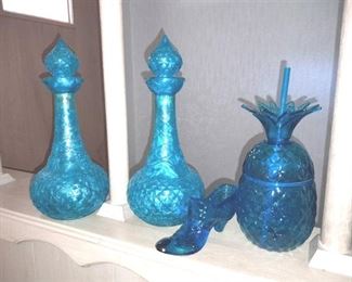 Teal colored home decor. (2)Vintage genie bottles, glass shoe and a plastic pineapple shaped glass