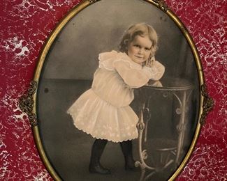 Many antique pictures in antique frames