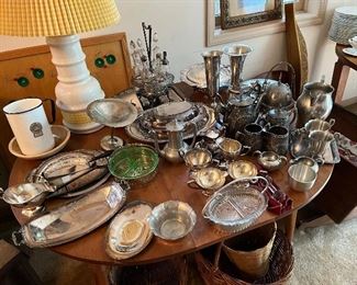 Table of silverplate and pewter items