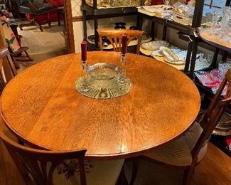 Nice antique round dining room table with 4 chairs