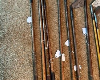 Multiple antique wood shaft golf clubs