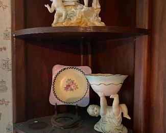 Why is that baby playing with such a large bowl? It must have superhuman strength!