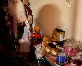 Father Christmas emerges from the shadows of summer.