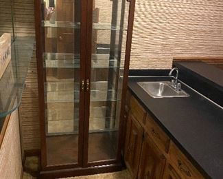 Tall curio cabinet.