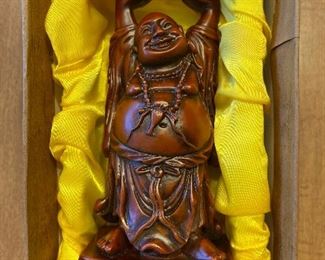 Happy Buddha raises the roof!