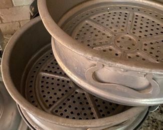 Stacking aluminum cook pots.