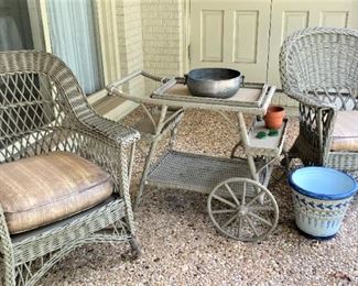 Two wicker chairs and serving cart