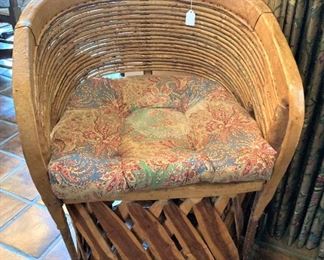 One of four rattan curved back chairs