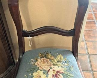 One of two needlepoint seat parlor chairs