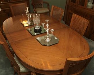 LIKE NEW, DINING TABLE WITH 3 LEAVES, CUSTOM PADS AND 8 CANE BACK MATCHING CHAIRS