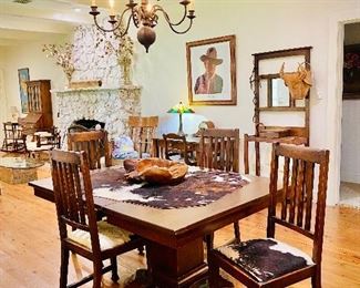 Antique dining table and 4 cowhide seat chairs 