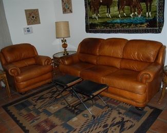 LOVELY LEATHER FURNITURE, RATTAN ACCENT TABLES, AREA RUG, TABLE LAMPS