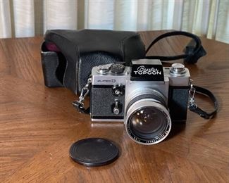 Beseler Topcon Super D 35mm SLR Camera Tokyo Kogaku R.E. Auto-Topcor 1:3.5 f2.5cm Lens 25mm f/3.5	4.25x6x4.75in	HxWxD
