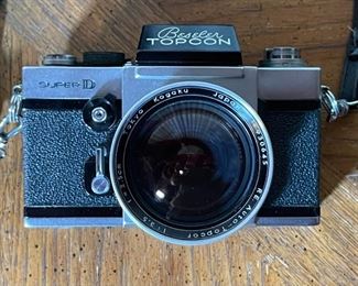 Beseler Topcon Super D 35mm SLR Camera Tokyo Kogaku R.E. Auto-Topcor 1:3.5 f2.5cm Lens 25mm f/3.5	4.25x6x4.75in	HxWxD
