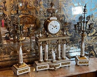 French Antique three piece marble, and gold mantle clock and candlesticks Medaille D’ Argent Crystal	Clock measurements: 27.5 inches, tall, 14.5 inches wide, 4.5 inches deep. Candlestick measurements: 26” x 10” x 10”.	
