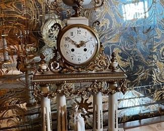 French Antique three piece marble, and gold mantle clock and candlesticks Medaille D’ Argent Crystal	Clock measurements: 27.5 inches, tall, 14.5 inches wide, 4.5 inches deep. Candlestick measurements: 26” x 10” x 10”.	
