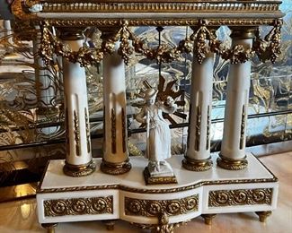 French Antique three piece marble, and gold mantle clock and candlesticks Medaille D’ Argent Crystal	Clock measurements: 27.5 inches, tall, 14.5 inches wide, 4.5 inches deep. Candlestick measurements: 26” x 10” x 10”.	
