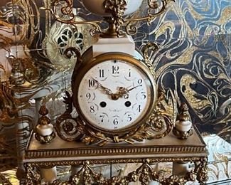 French Antique three piece marble, and gold mantle clock and candlesticks Medaille D’ Argent Crystal	Clock measurements: 27.5 inches, tall, 14.5 inches wide, 4.5 inches deep. Candlestick measurements: 26” x 10” x 10”.	

