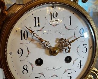 French Antique three piece marble, and gold mantle clock and candlesticks Medaille D’ Argent Crystal	Clock measurements: 27.5 inches, tall, 14.5 inches wide, 4.5 inches deep. Candlestick measurements: 26” x 10” x 10”.	
