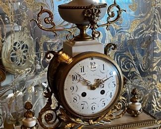 French Antique three piece marble, and gold mantle clock and candlesticks Medaille D’ Argent Crystal	Clock measurements: 27.5 inches, tall, 14.5 inches wide, 4.5 inches deep. Candlestick measurements: 26” x 10” x 10”.	
