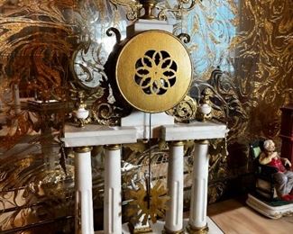 French Antique three piece marble, and gold mantle clock and candlesticks Medaille D’ Argent Crystal	Clock measurements: 27.5 inches, tall, 14.5 inches wide, 4.5 inches deep. Candlestick measurements: 26” x 10” x 10”.	
