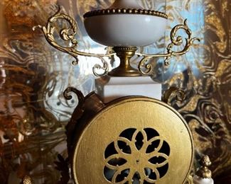 French Antique three piece marble, and gold mantle clock and candlesticks Medaille D’ Argent Crystal	Clock measurements: 27.5 inches, tall, 14.5 inches wide, 4.5 inches deep. Candlestick measurements: 26” x 10” x 10”.	
