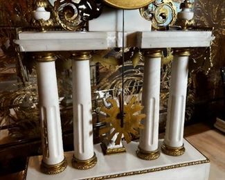 French Antique three piece marble, and gold mantle clock and candlesticks Medaille D’ Argent Crystal	Clock measurements: 27.5 inches, tall, 14.5 inches wide, 4.5 inches deep. Candlestick measurements: 26” x 10” x 10”.	
