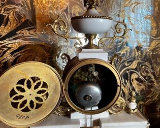 French Antique three piece marble, and gold mantle clock and candlesticks Medaille D’ Argent Crystal	Clock measurements: 27.5 inches, tall, 14.5 inches wide, 4.5 inches deep. Candlestick measurements: 26” x 10” x 10”.	
