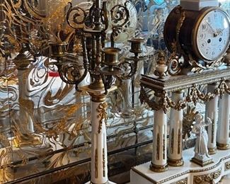 French Antique three piece marble, and gold mantle clock and candlesticks Medaille D’ Argent Crystal	Clock measurements: 27.5 inches, tall, 14.5 inches wide, 4.5 inches deep. Candlestick measurements: 26” x 10” x 10”.	
