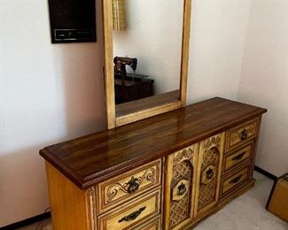 Nine drawer console dresser with mirror	Console dresser measurements, 30.5 x 70.5 x 19 mirror measurements 49.5 x 32.	
