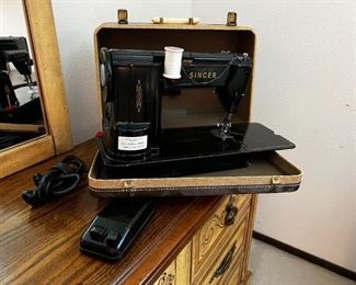 Singer 301 A sewing machine with case & pedal & accessories	11.5 x 19 x 7.	HxWxD
