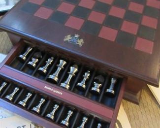 Rare Noble Games chess set, designed by David R. Ripley. Wood and leather board, with brass and stainless steel pieces.
