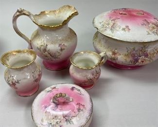 Anchor Pink Bathroom set: Pitcher/Basin, Small pitcher, shaving cup, toothbrush holder, soap dish and chamber pot. (small chip on bottom of basin and handle missing off chamber pot)        $95.00