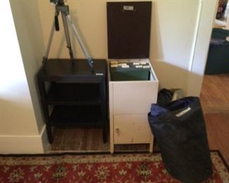 Two queen sized blow up mattresses   Lift top file cabinet, key in bottom. Tri-pod