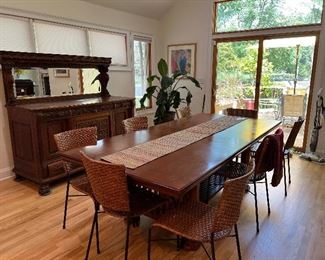 Wood Rectangular Dinner Table with 2 leaves..
6 matching wicker/Metal chairs