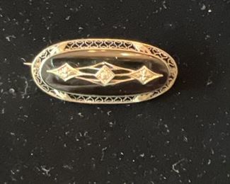 Marked 10K Gold with center diamond