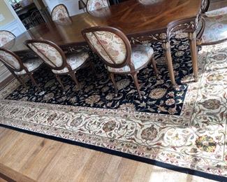 Dining room rug for sale size is 10x14 ft.