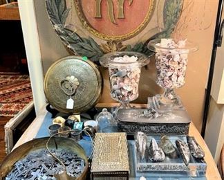 Art, crystal, shells, ammonite pendants, crosses and French table with inlaid leather top