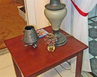 One of two end tables (that match coffee table under television)  and lamp