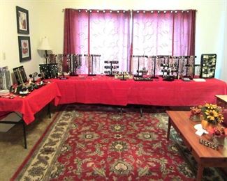 Room view showing large rug and costume jewelry set up