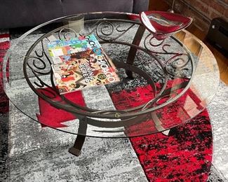 Round glass top and metal cocktail table, 42" x 16", $165