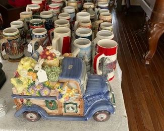 LOTS NICE BEER STEINS , AND FRITS AND FLOYD COOKIE JAR .