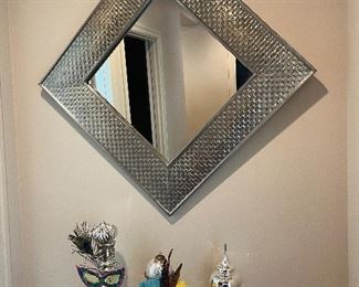 $190   Hammered metal wrapped mirror.
30 in.² by 1.5 inches deep