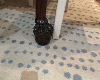 Close-up of the dining table seat and rug sold in a following photo.  