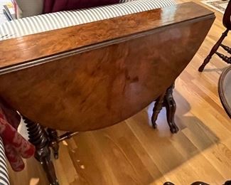 $460  Antique English table.  Measures when both drop leaves are down, 6.5 inches deep.  width is 35.5 inches height 29 inches. When open oval table is 48 inches long