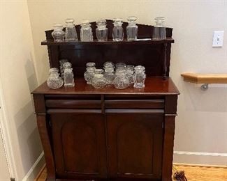$430. Wonderful antique piece - use in any room in the home.  Antique pickle jars sold during in-person sale hours on Friday and Saturday.  Chest is 39"w x 50"h x 16"d.