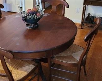 Dining table and six rush bottom chairs