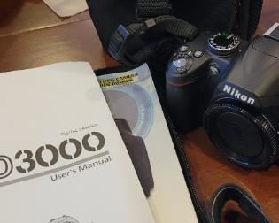 Nikon D3000 Digital camera with no lens, comes with original manual and carrying case